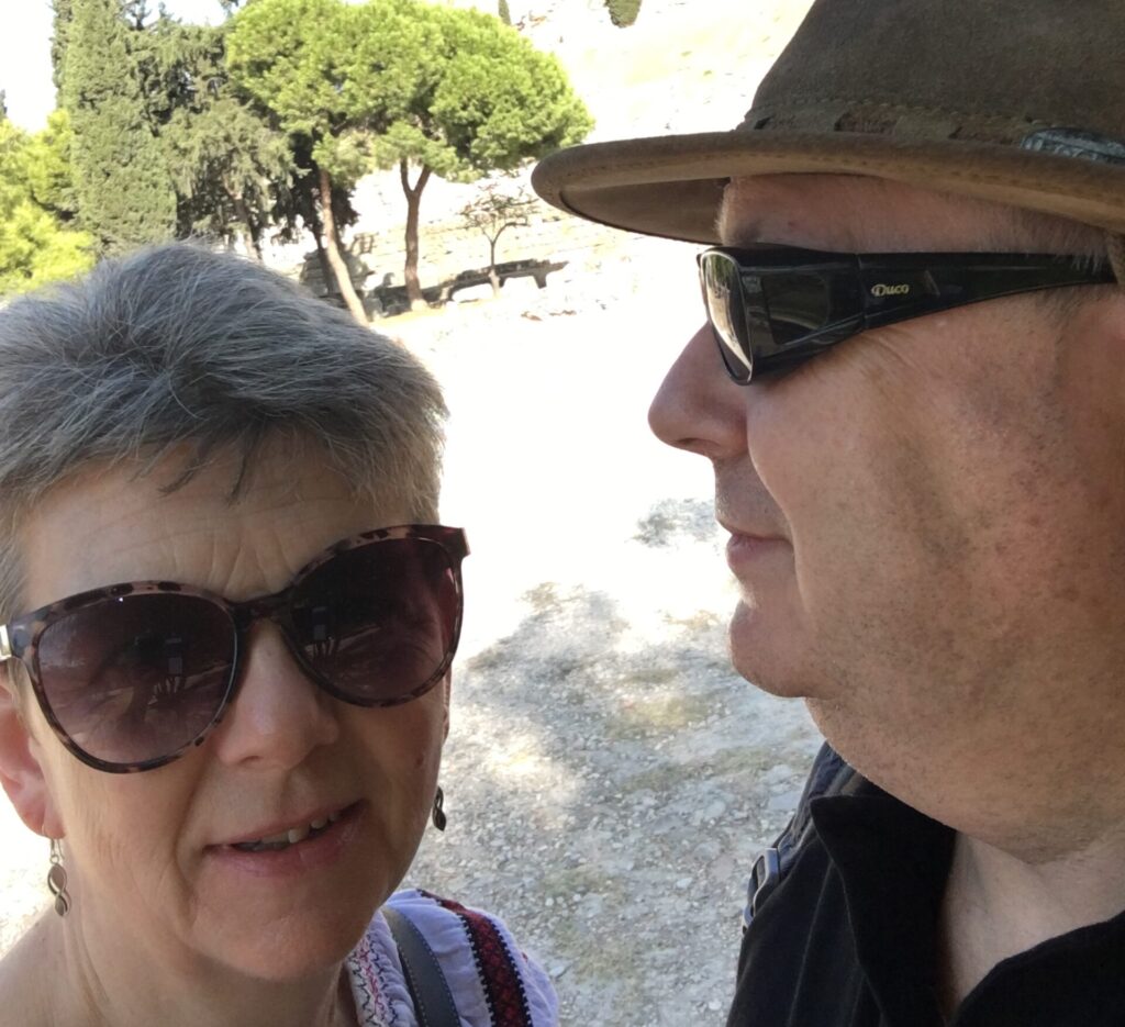 man and woman in front of the Acropolis